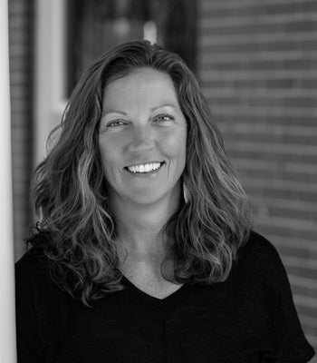 Portrait of Laurie Huggins, Broker / Partner / COO.